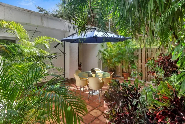 a view of a table and chairs in patio