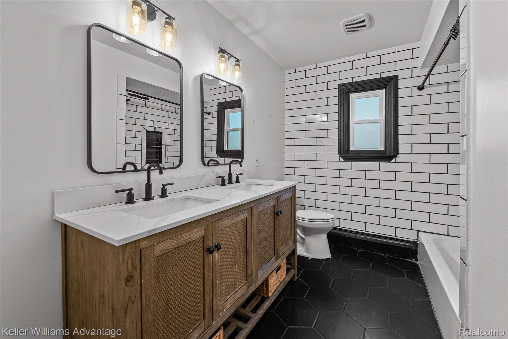 5722 Raven Road Bloomfield Hills, MI 48301 - Photo 31 of 34 Double vanity with white countertop and integrated sinks