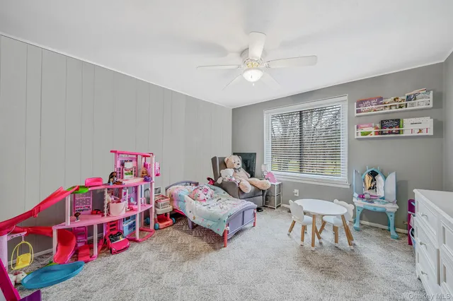 a bedroom with furniture and a window