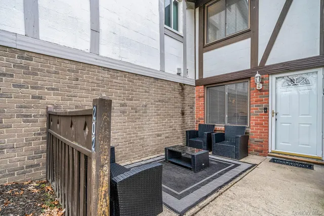 a brick building with a bench in front of it