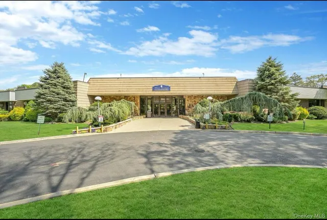 a view of yard with swimming pool and green space