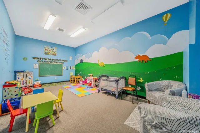 a room with furniture and a play table