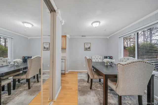 a view of a dining room with furniture and window