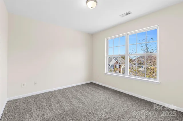 an empty room with windows and with window