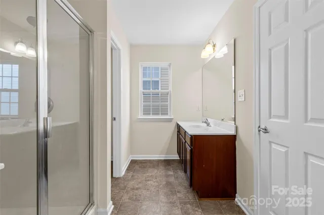 a view of a bathroom with a sink and mirror