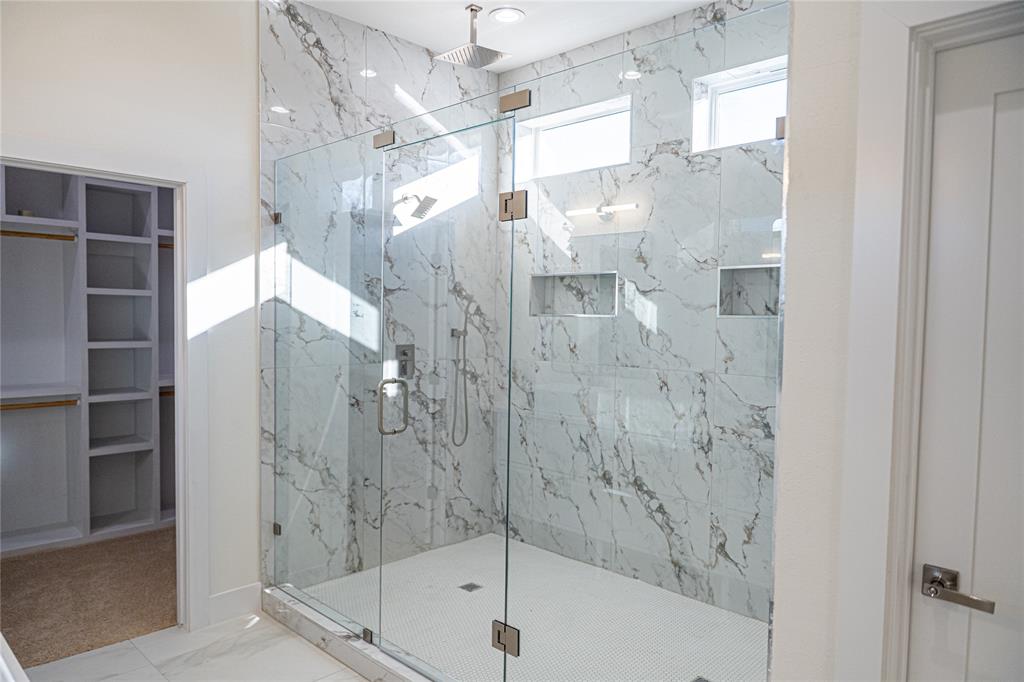 1135 Riverwood Road Dallas, TX 75217 - Photo 12 of 17 a bathroom with a bathtub and a shower
