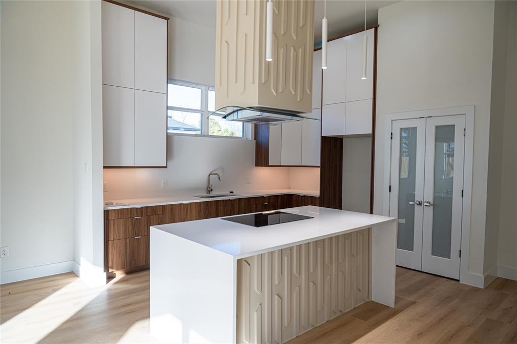 1135 Riverwood Road Dallas, TX 75217 - Photo 9 of 17 a kitchen with a sink a stove and a refrigerator