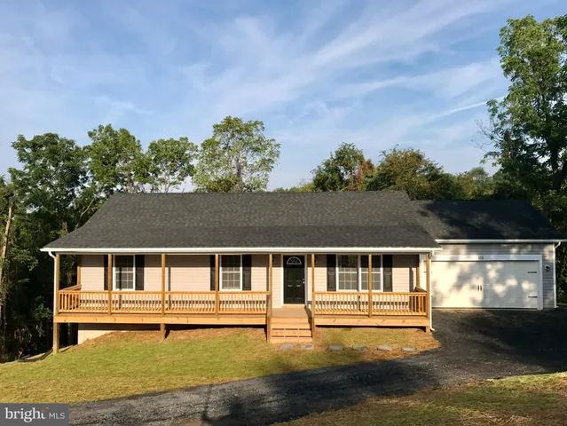 a house with swimming pool in front of it