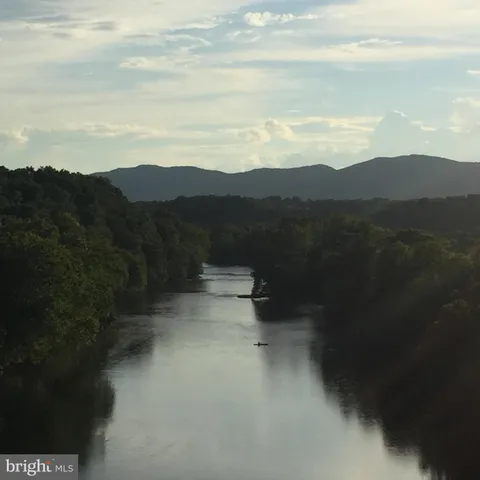 a view of lake with mountain