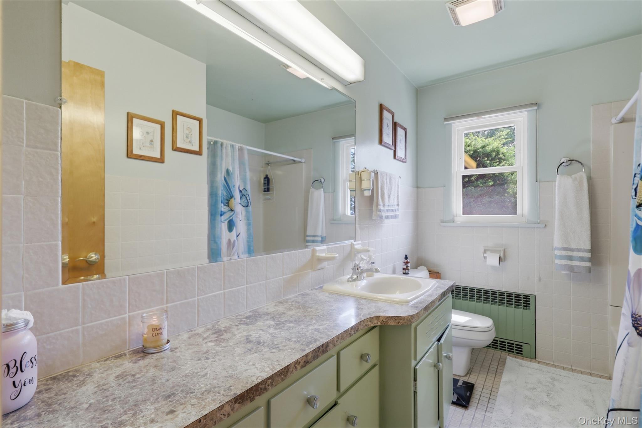 1 Hiko Place Fishkill, NY 12524 - Photo 22 of 41 Bathroom featuring a vanity with an integrated sink, patterned countertop, and light green cabinetry