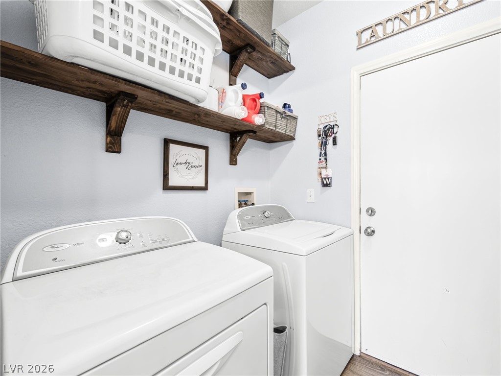 2199 Maple Shade Street Henderson, NV 89002 - Photo 22 of 75 Separate laundry room with access to the garage, additional storage shelving, and sink