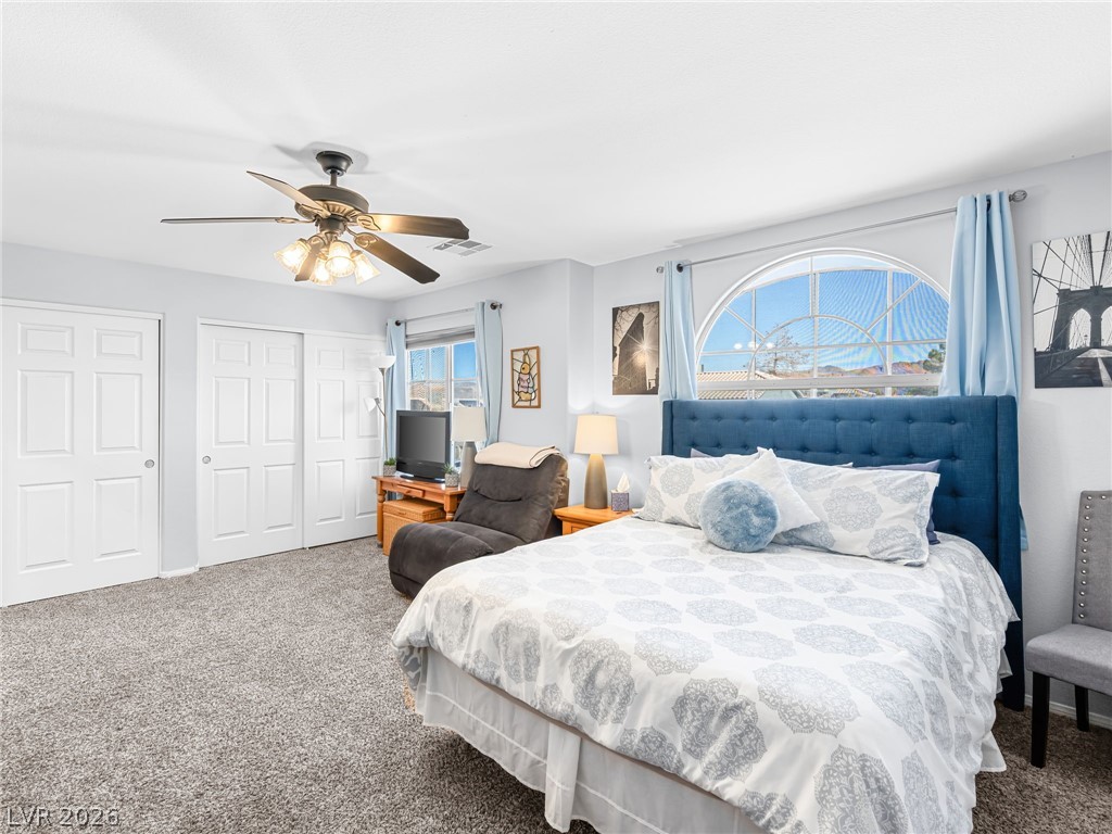 2199 Maple Shade Street Henderson, NV 89002 - Photo 26 of 75 Oversized Bedroom 2 featuring carpet flooring and a ceiling fan.