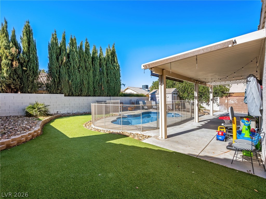 2199 Maple Shade Street Henderson, NV 89002 - Photo 39 of 75 Resurfaced pool with all-new fencing, surrounded by artificial turf for year-round greenery. Fenced backyard includes a shed, large covered patio for entertaining and shade, and RV parking with poured concrete and a large RV gate.