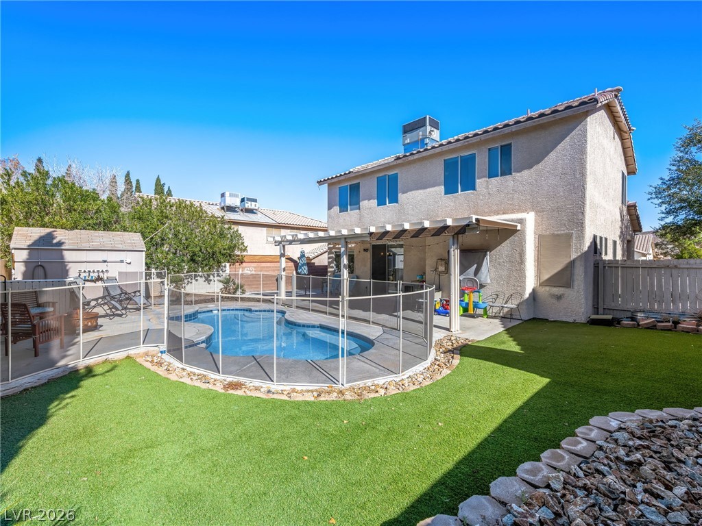 2199 Maple Shade Street Henderson, NV 89002 - Photo 40 of 75 Resurfaced pool with all-new fencing, surrounded by artificial turf for year-round greenery. Fenced backyard includes a shed, large covered patio for entertaining and shade, and RV parking with poured concrete and a large RV gate.