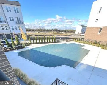 a view of a swimming pool with an ocean view