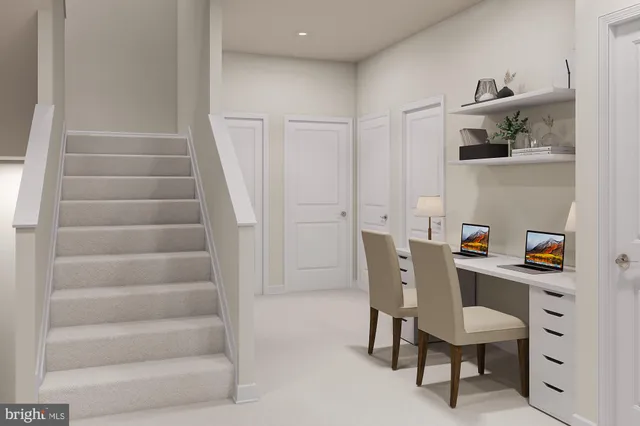 a view of a room with furniture and wooden floor