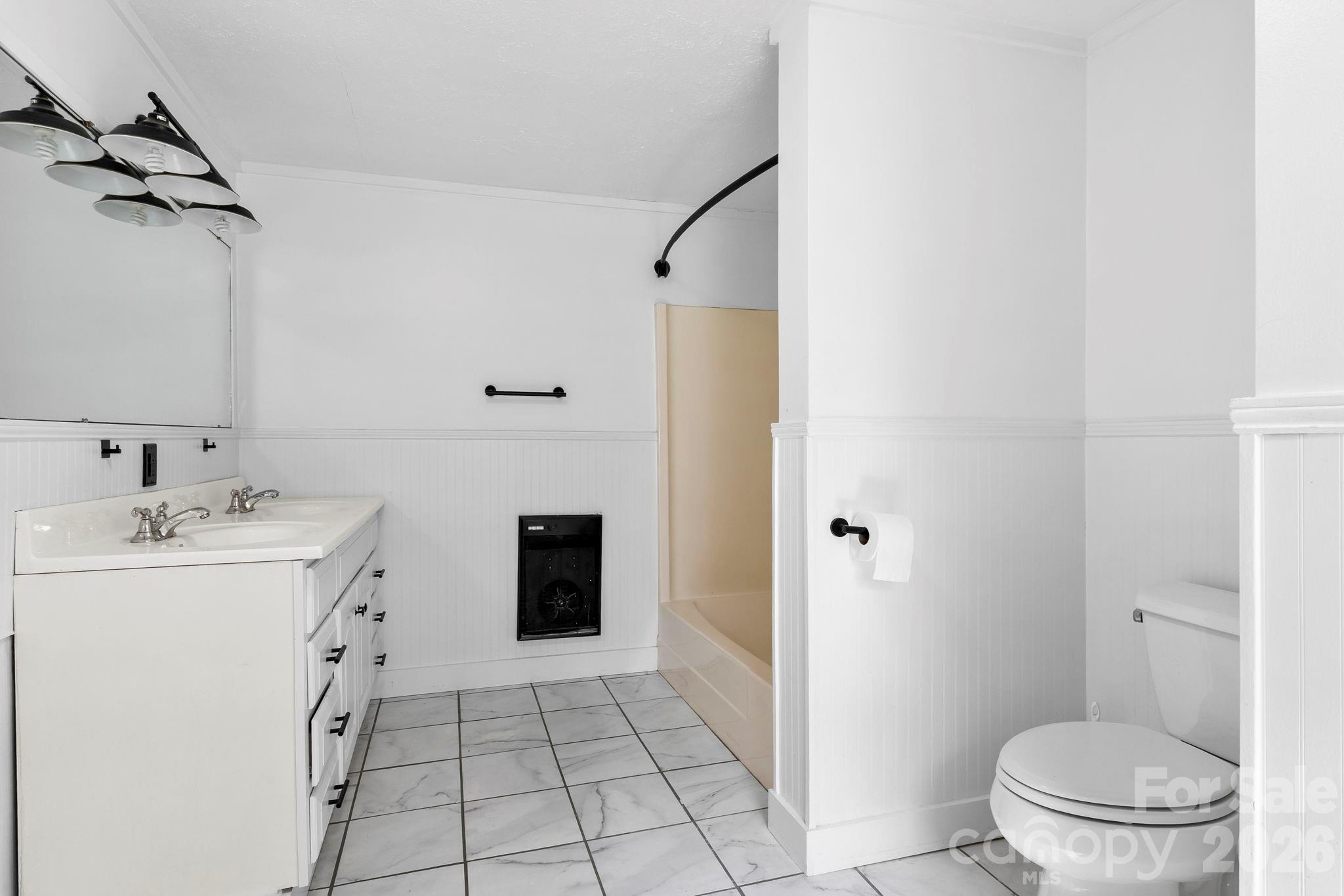 42 Old Patton Hill Road Swannanoa, NC 28778 - Photo 22 of 33 a spacious bathroom with a sink a toilet and shower