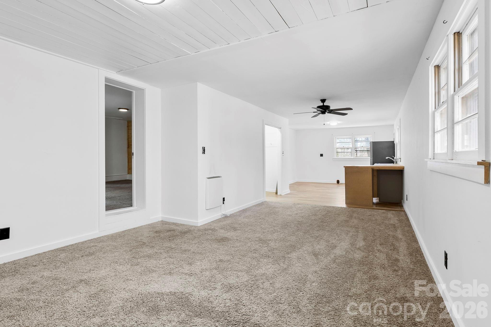 42 Old Patton Hill Road Swannanoa, NC 28778 - Photo 24 of 33 a view of a big room with wooden cabinet and windows
