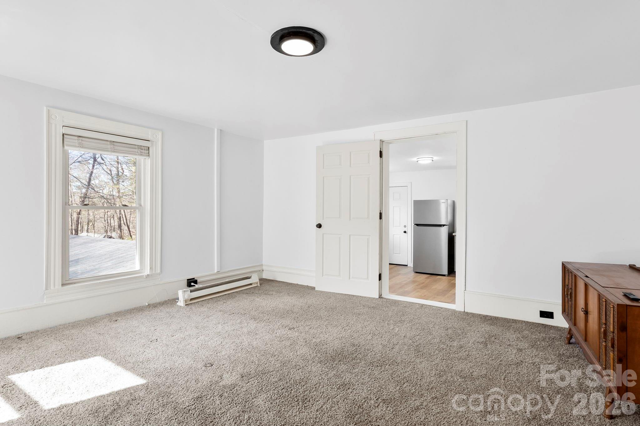 42 Old Patton Hill Road Swannanoa, NC 28778 - Photo 29 of 33 an empty room with windows and closet