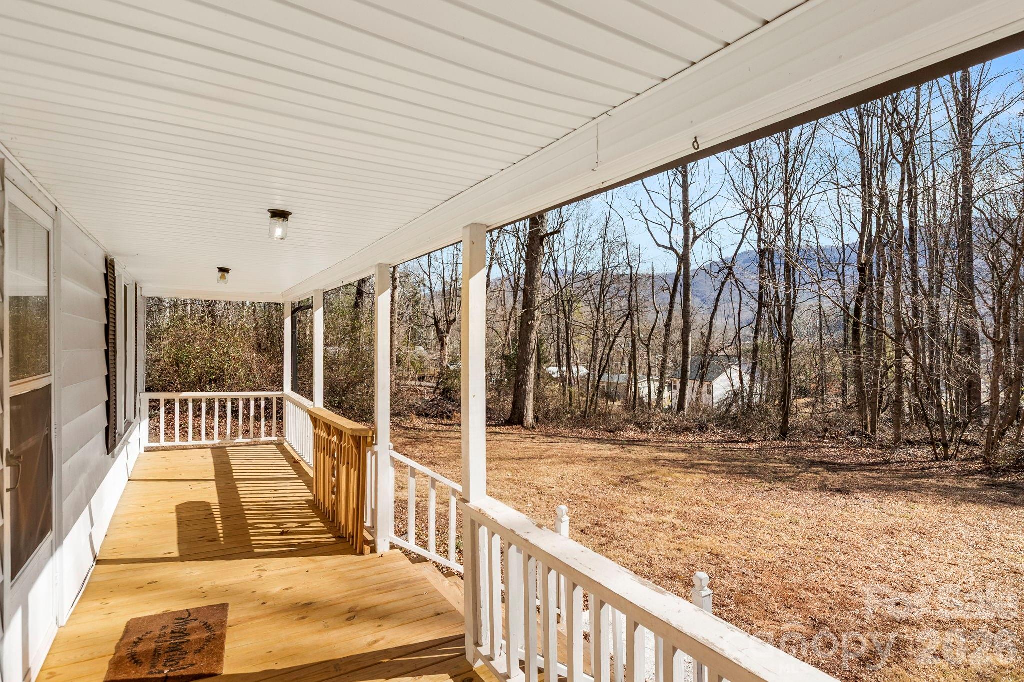 42 Old Patton Hill Road Swannanoa, NC 28778 - Photo 3 of 33 a view of balcony with floor to ceiling window and wooden fence