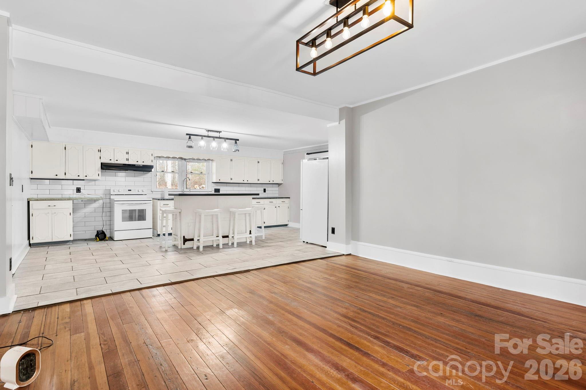 42 Old Patton Hill Road Swannanoa, NC 28778 - Photo 6 of 33 a large kitchen with stainless steel appliances granite countertop a sink and cabinets