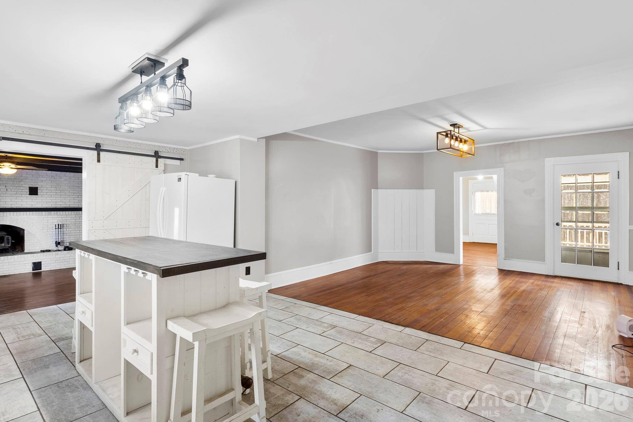 42 Old Patton Hill Road Swannanoa, NC 28778 - Photo 9 of 33 a kitchen with granite countertop a stove a sink and a refrigerator