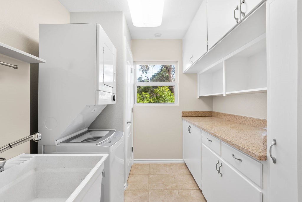 1931 North Fulton Beach Road Rockport, TX 78382 - Photo 21 of 40 a kitchen with a sink window and cabinets