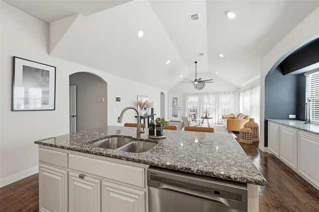 a kitchen with granite countertop stainless steel appliances and granite counter tops