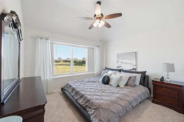 a bed room with a bed and a chandelier