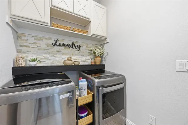 a view of a patio with table and chairs and potted plants