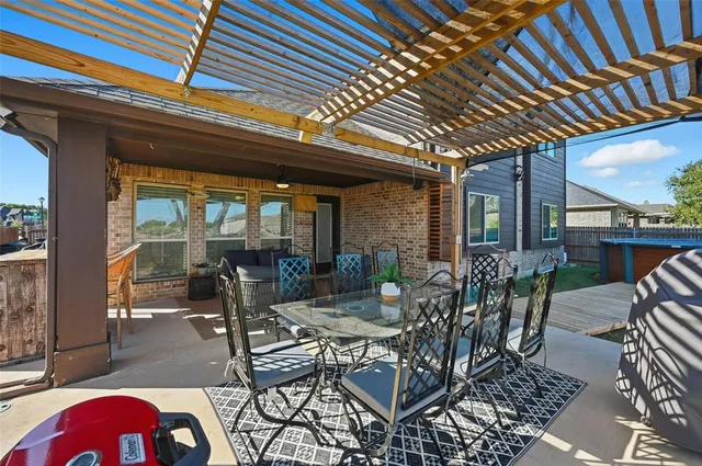 a view of swimming pool with a yard and plants