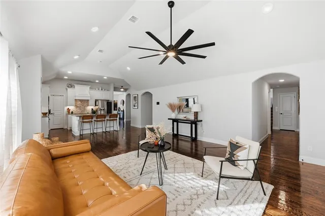 a kitchen with cabinets and refrigerator