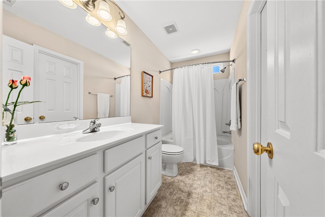 105 Ledgewood Way Easley, SC 29642 - Photo 18 of 35 This bright bathroom features a vanity, bathtub, and shower for comfortable daily routines.
