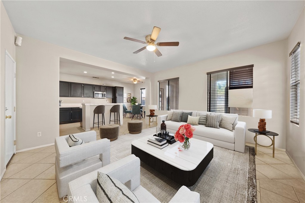 3907 Albillo Loop Perris, CA 92571 - Photo 1 of 1 a living room with furniture white walls and white walls