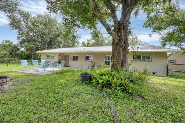 a view of backyard with green space