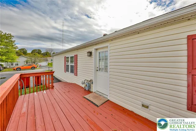 a balcony with wooden floor