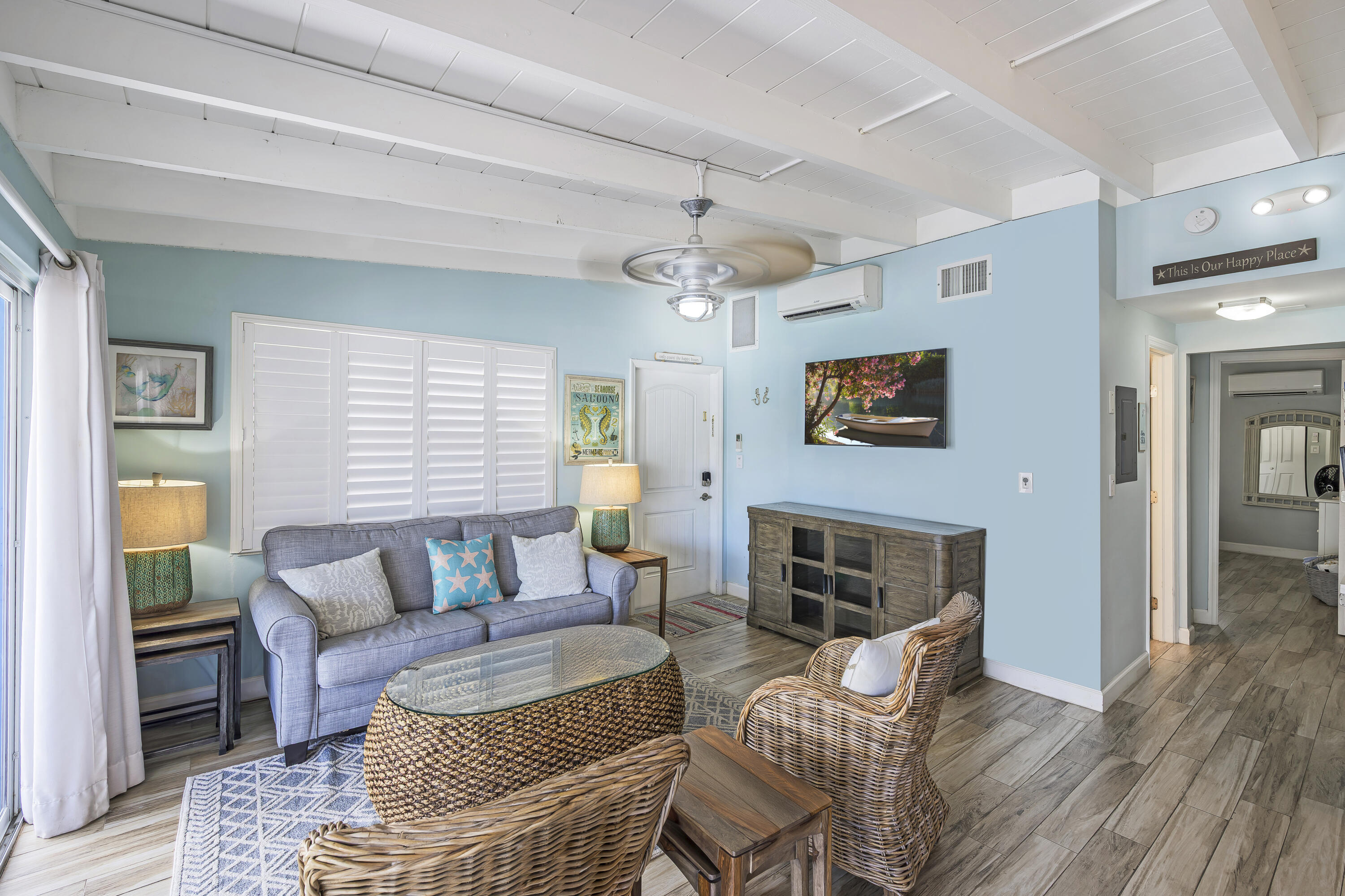 340 10th Street Key Colony Beach, FL 33051 - Photo 12 of 24 a living room with furniture and a fireplace
