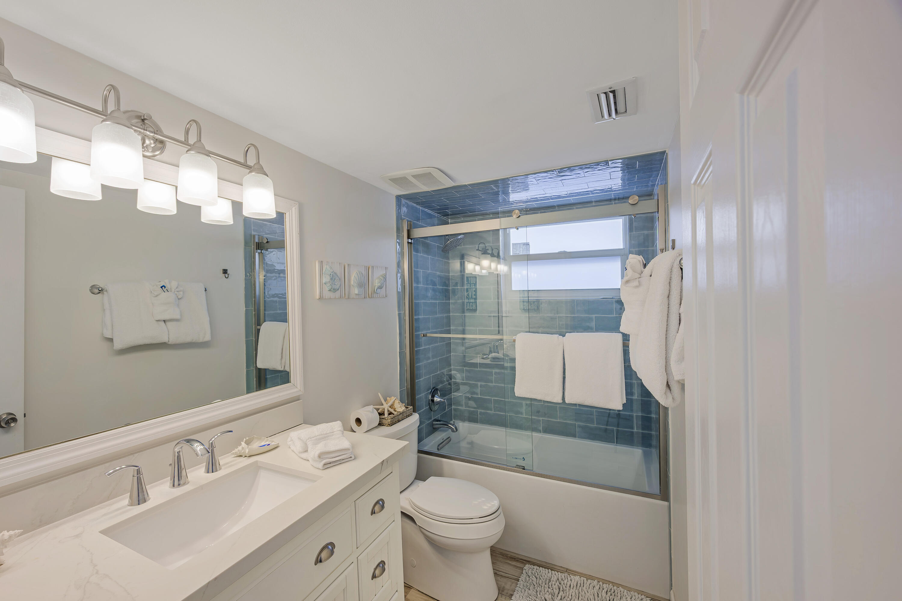 340 10th Street Key Colony Beach, FL 33051 - Photo 16 of 24 a bathroom with a sink a toilet and shower