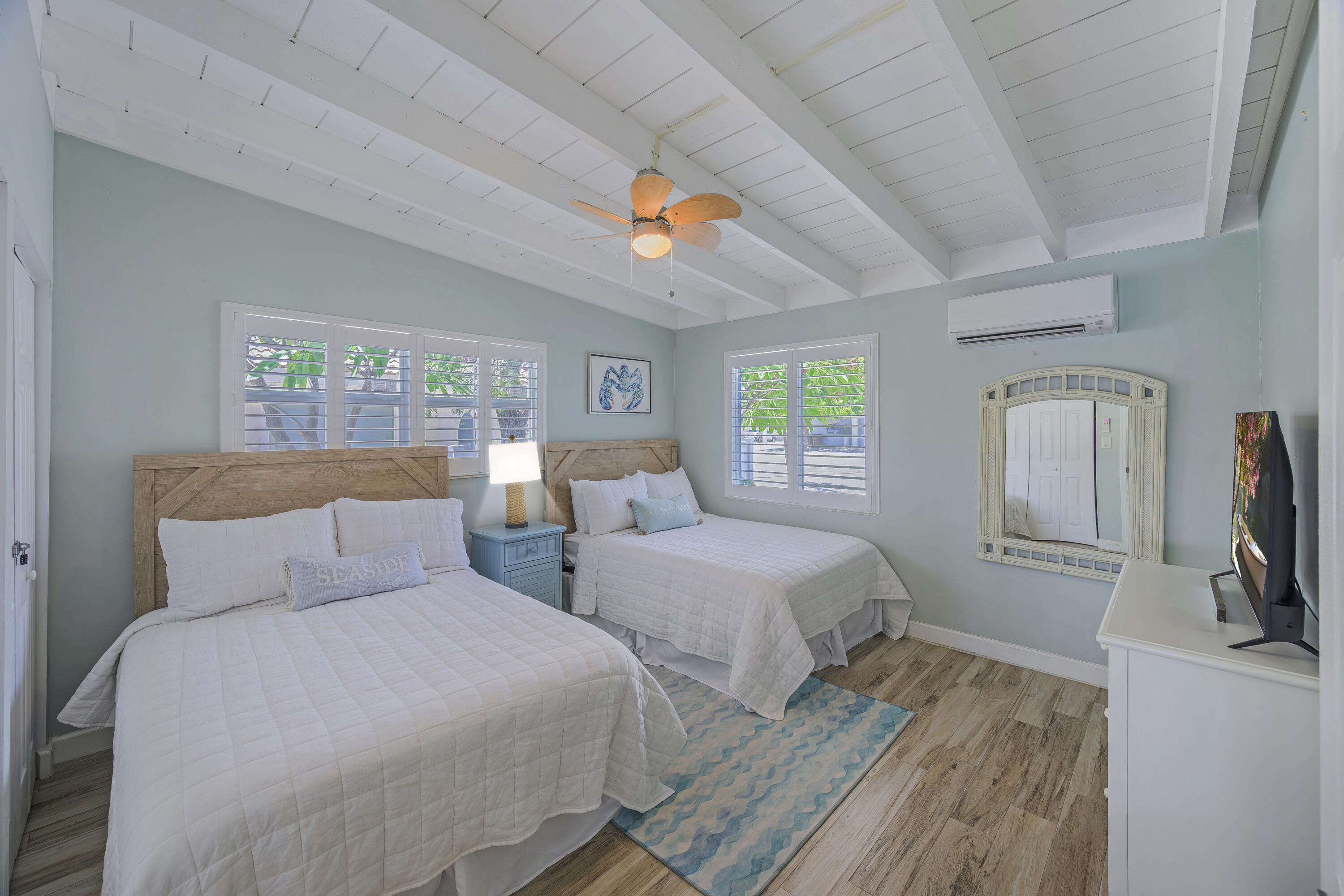 340 10th Street Key Colony Beach, FL 33051 - Photo 18 of 24 a bedroom with two beds and a flat screen tv