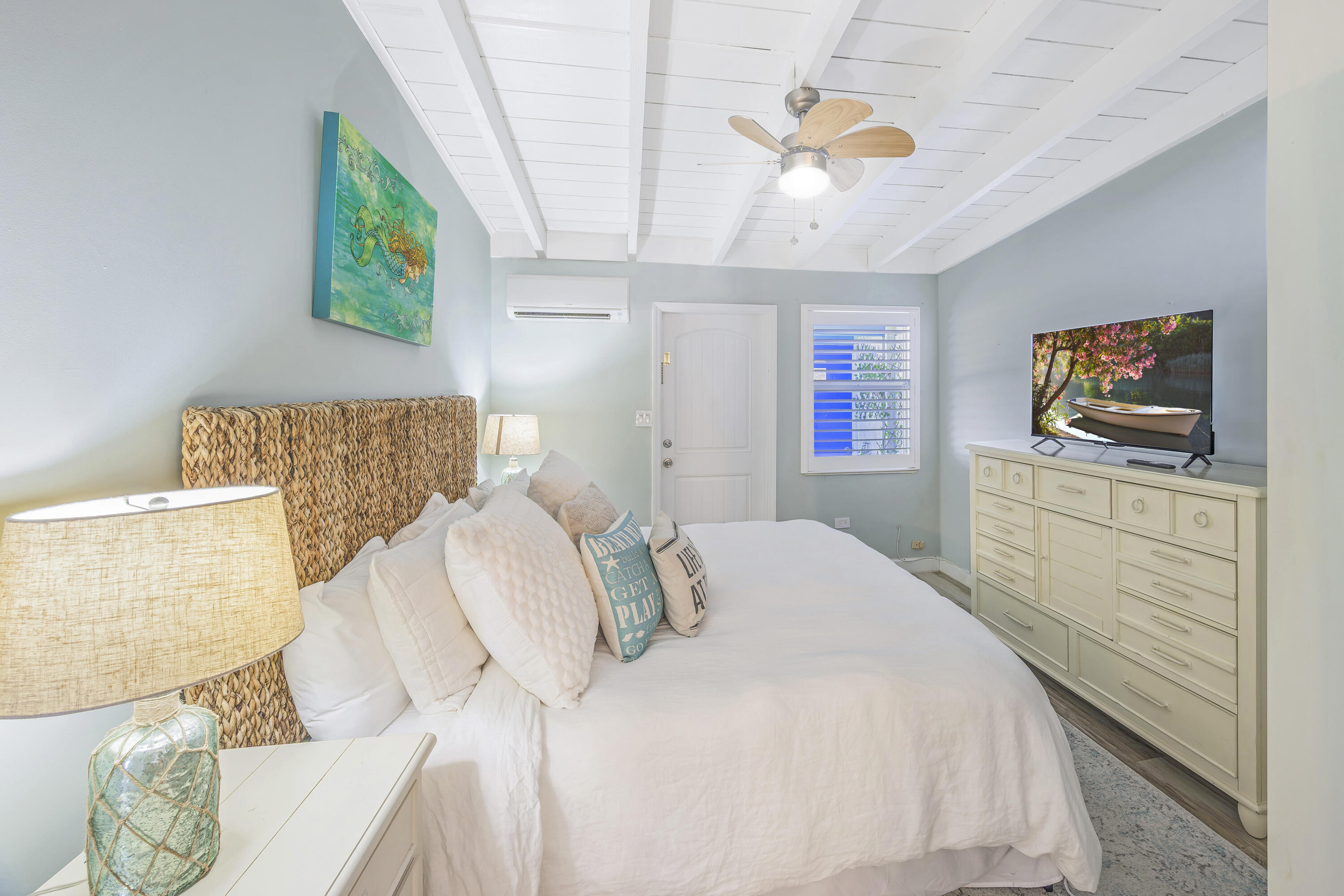 340 10th Street Key Colony Beach, FL 33051 - Photo 21 of 24 a bedroom with a bed and a flat screen tv