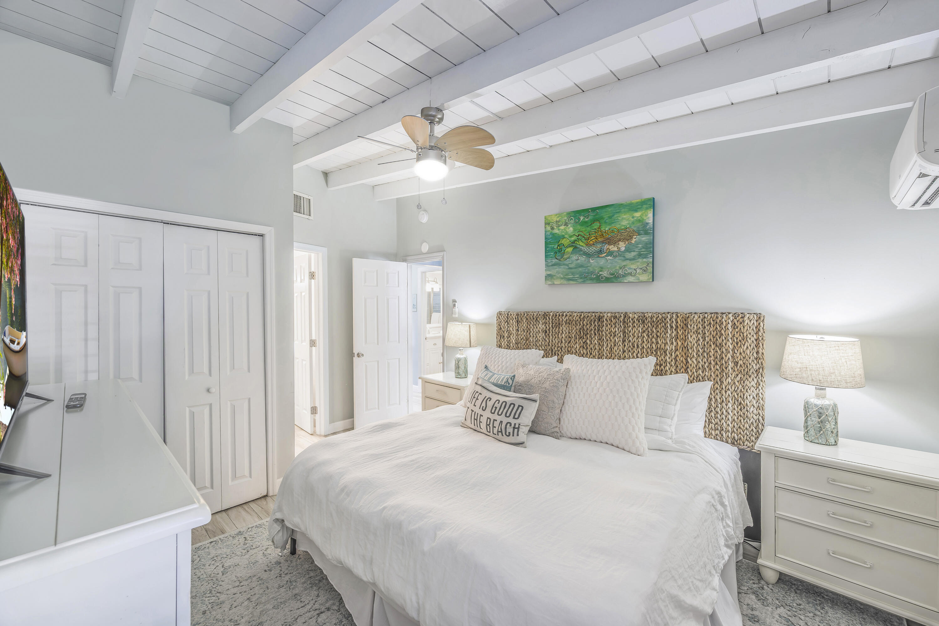340 10th Street Key Colony Beach, FL 33051 - Photo 22 of 24 a bedroom with a bed and a couch
