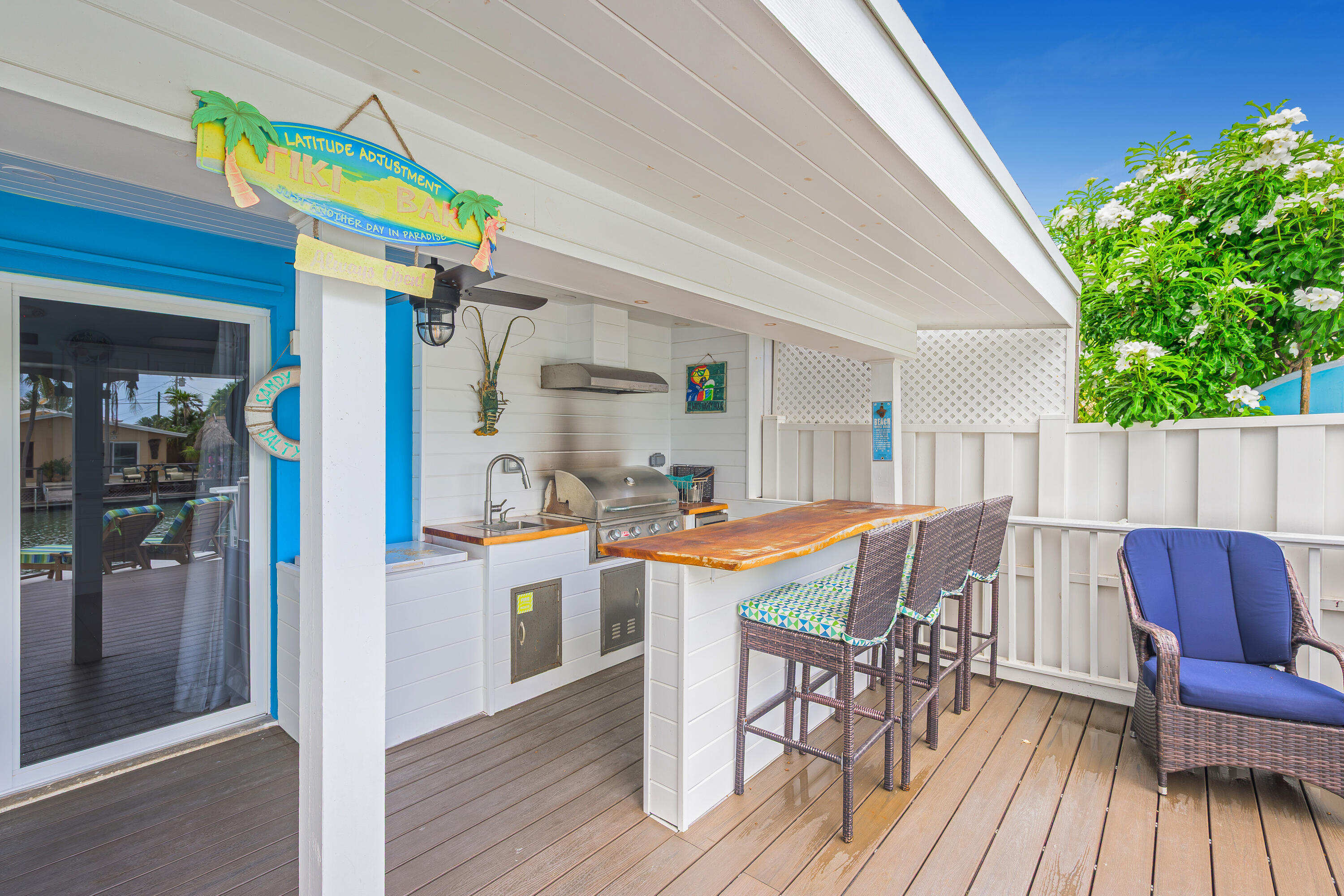 340 10th Street Key Colony Beach, FL 33051 - Photo 7 of 24 a view of a dining room with furniture and wooden floor