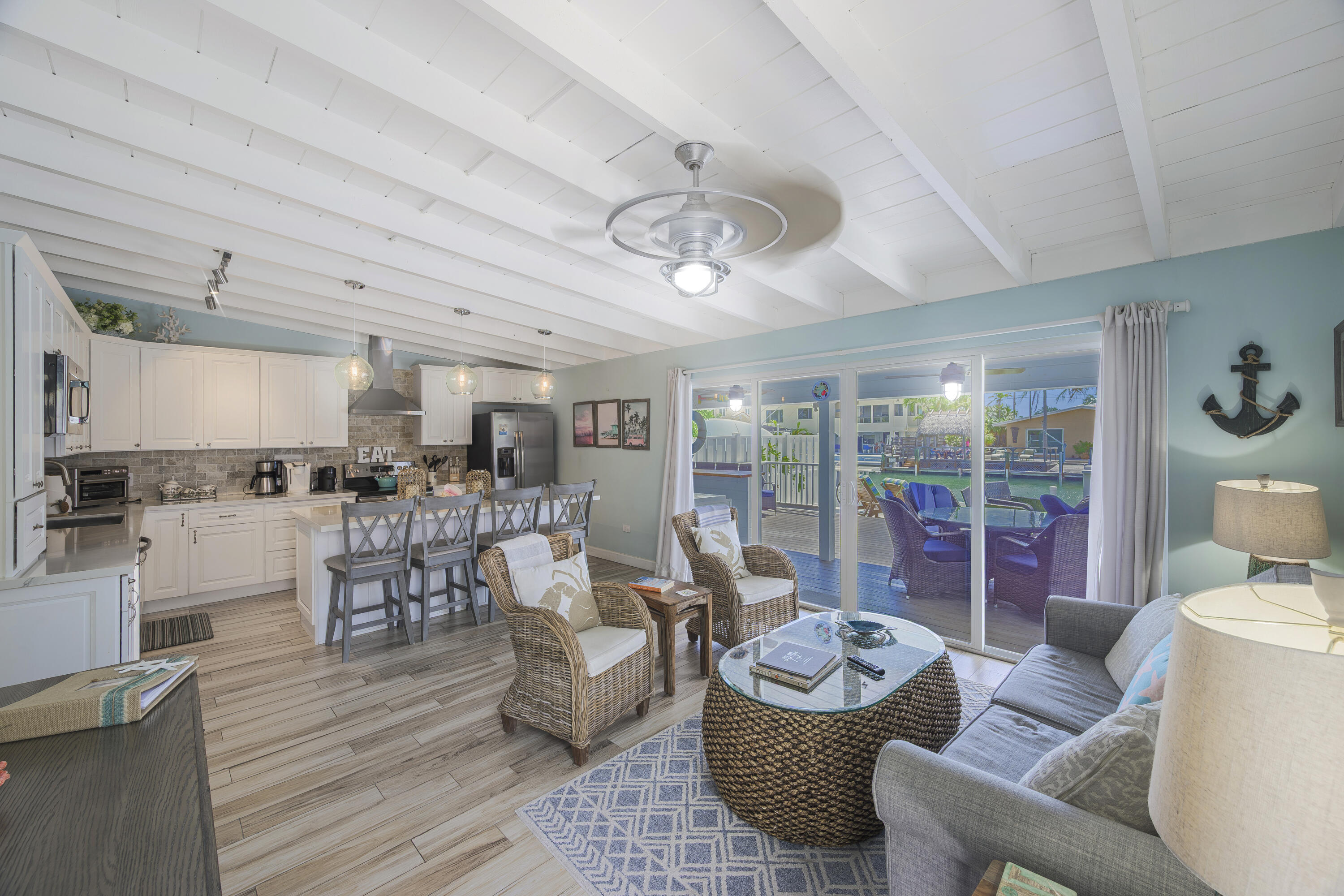 340 10th Street Key Colony Beach, FL 33051 - Photo 10 of 24 a living room with furniture and a large window