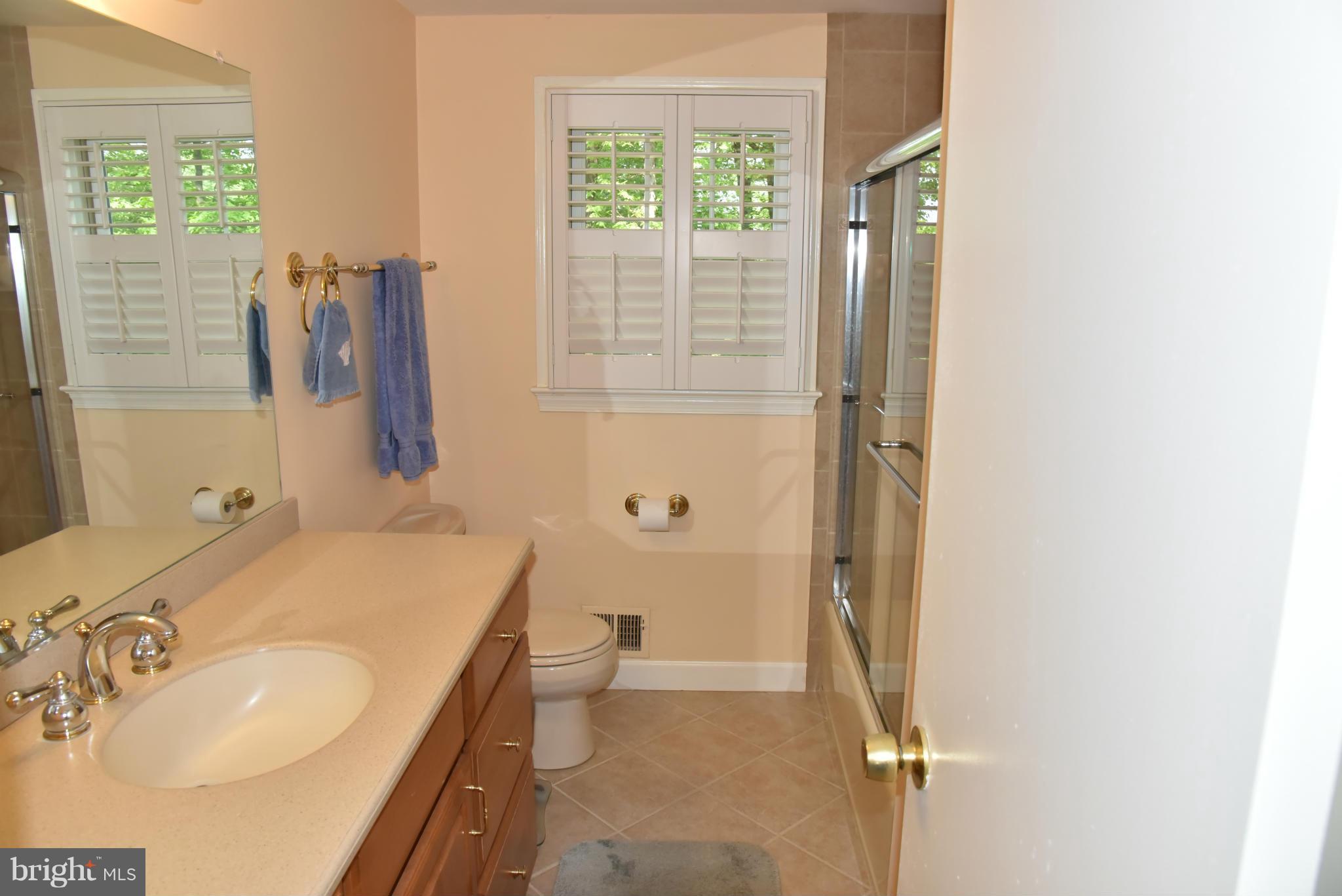 3821 King Arthur Road Annandale, VA 22003 - Photo 14 of 30 a bathroom with a sink toilet and shower