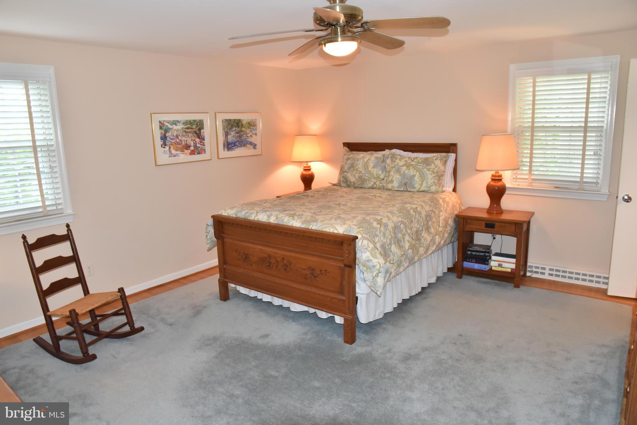3821 King Arthur Road Annandale, VA 22003 - Photo 17 of 30 a bedroom with a bed and a chandelier