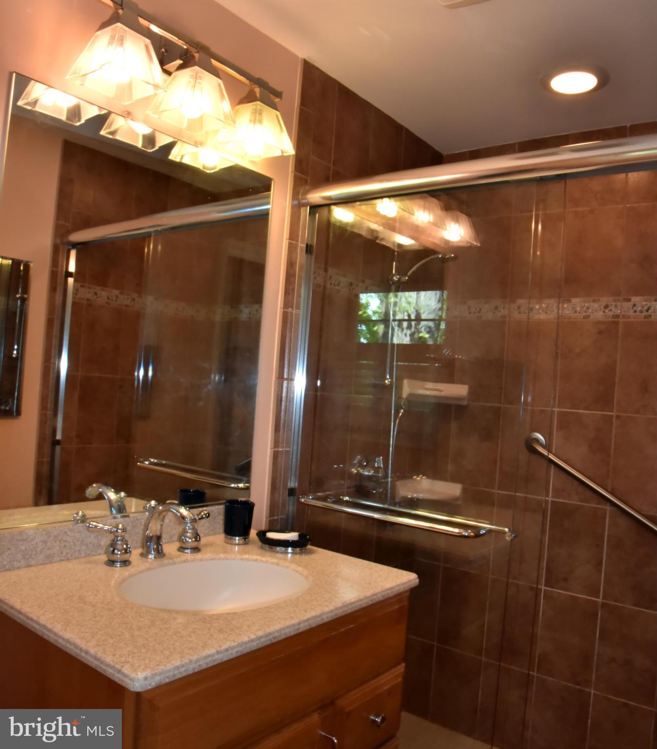3821 King Arthur Road Annandale, VA 22003 - Photo 20 of 30 a bathroom with a sink and a mirror