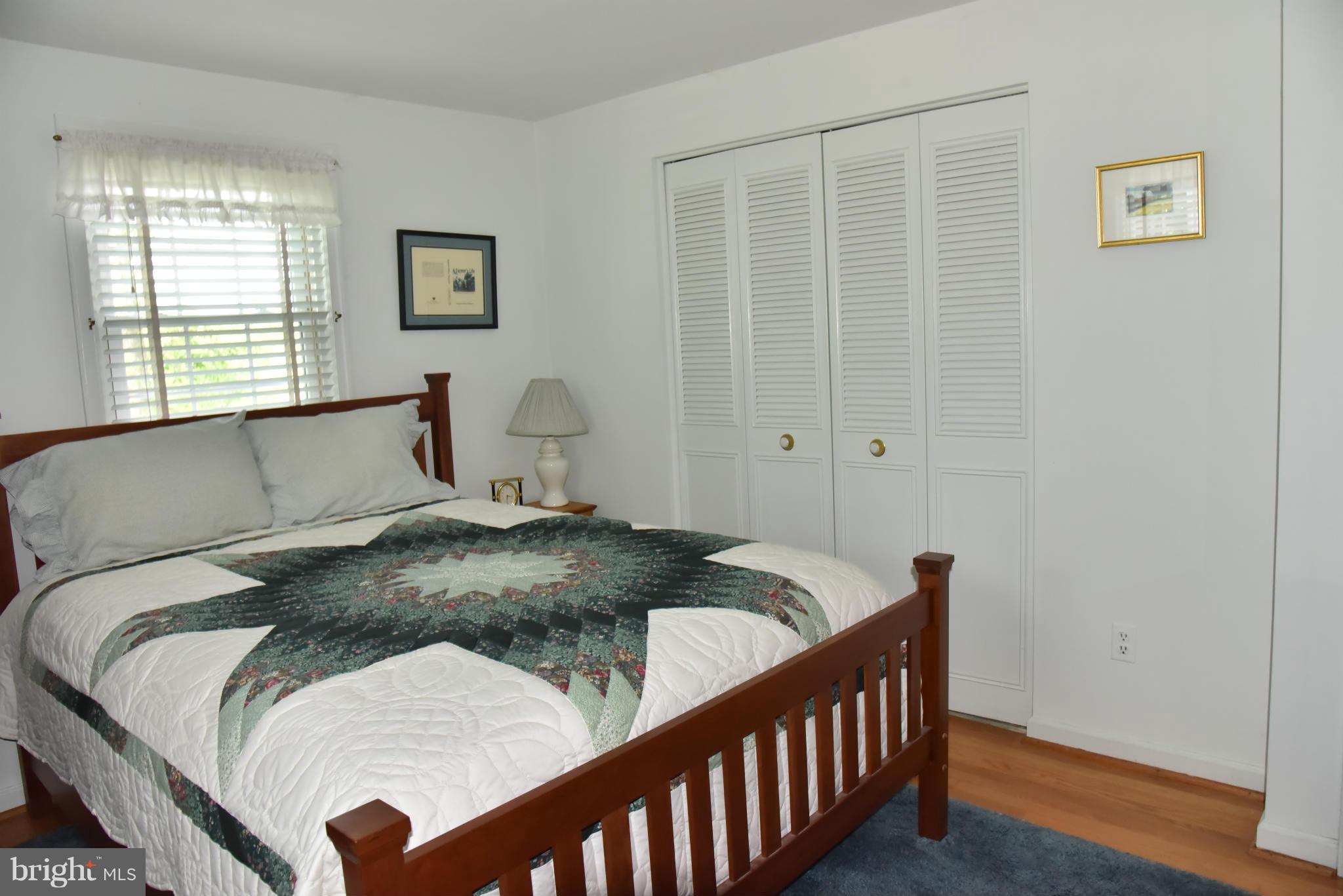 3821 King Arthur Road Annandale, VA 22003 - Photo 22 of 30 a bed sitting in a bedroom next to a window