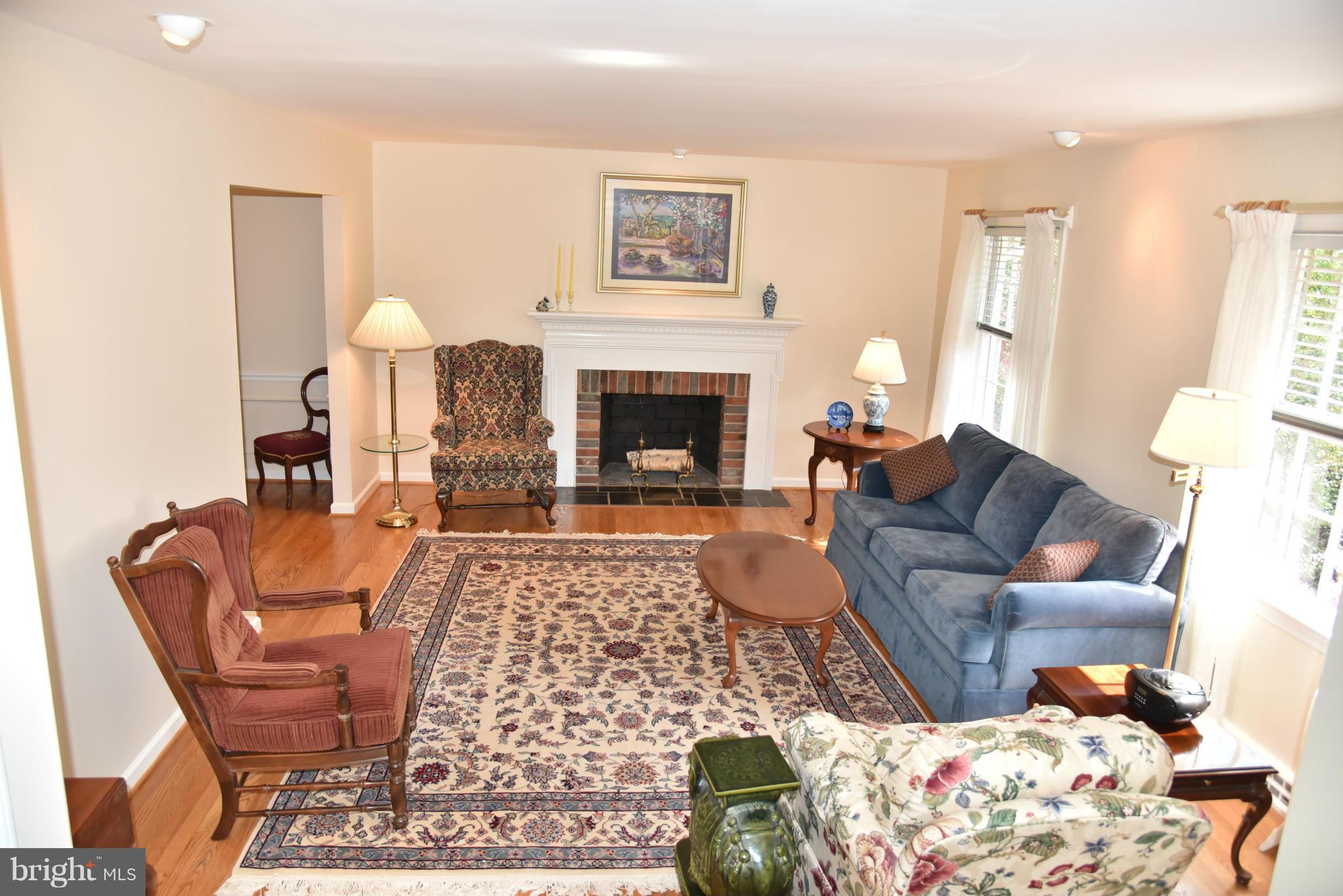 3821 King Arthur Road Annandale, VA 22003 - Photo 26 of 30 a living room with furniture and a fireplace