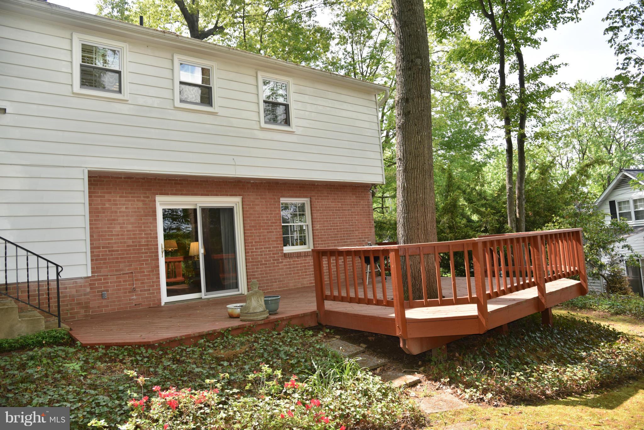 3821 King Arthur Road Annandale, VA 22003 - Photo 30 of 30 a view of a house with wooden deck and furniture