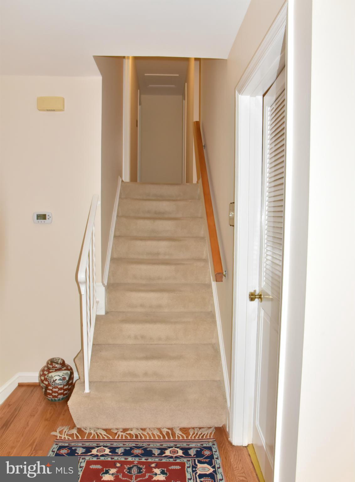 3821 King Arthur Road Annandale, VA 22003 - Photo 9 of 30 a view of staircase with white walls and a window
